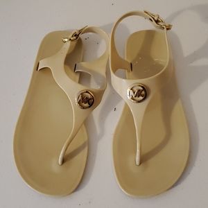 Michael Kors tan flip flops